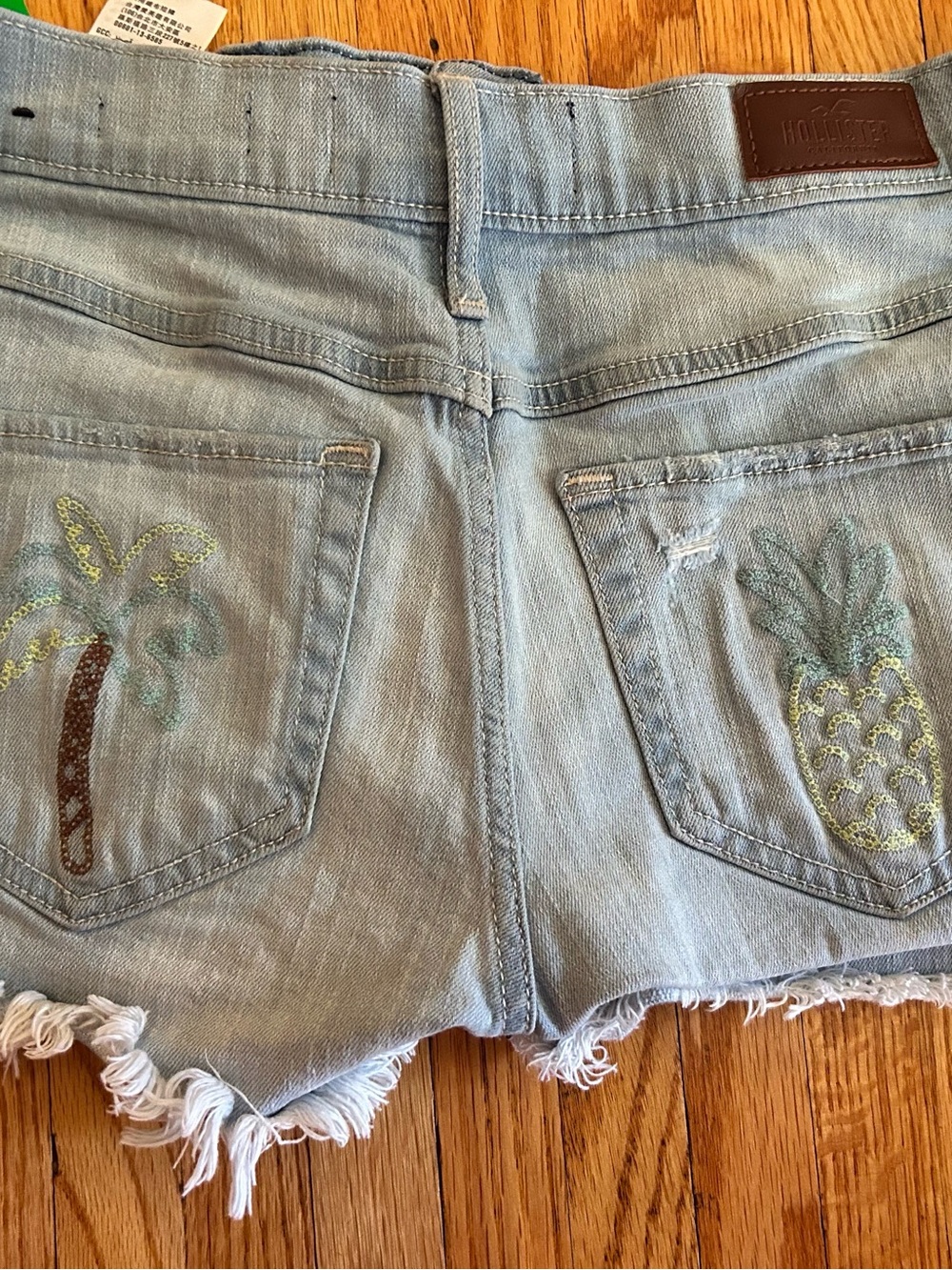 Hollister Light Wash Denim Cutoff Shorts with Tropical Embroidery